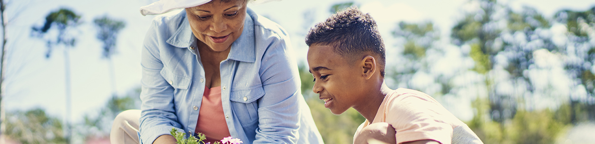 grandmother and grandson gardening
