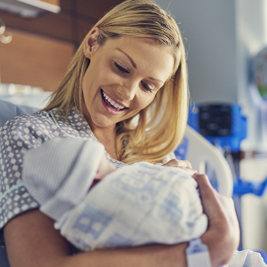 new mother with her newborn baby in a hospital
