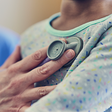 close up of a doctor checking heart rate on a patient